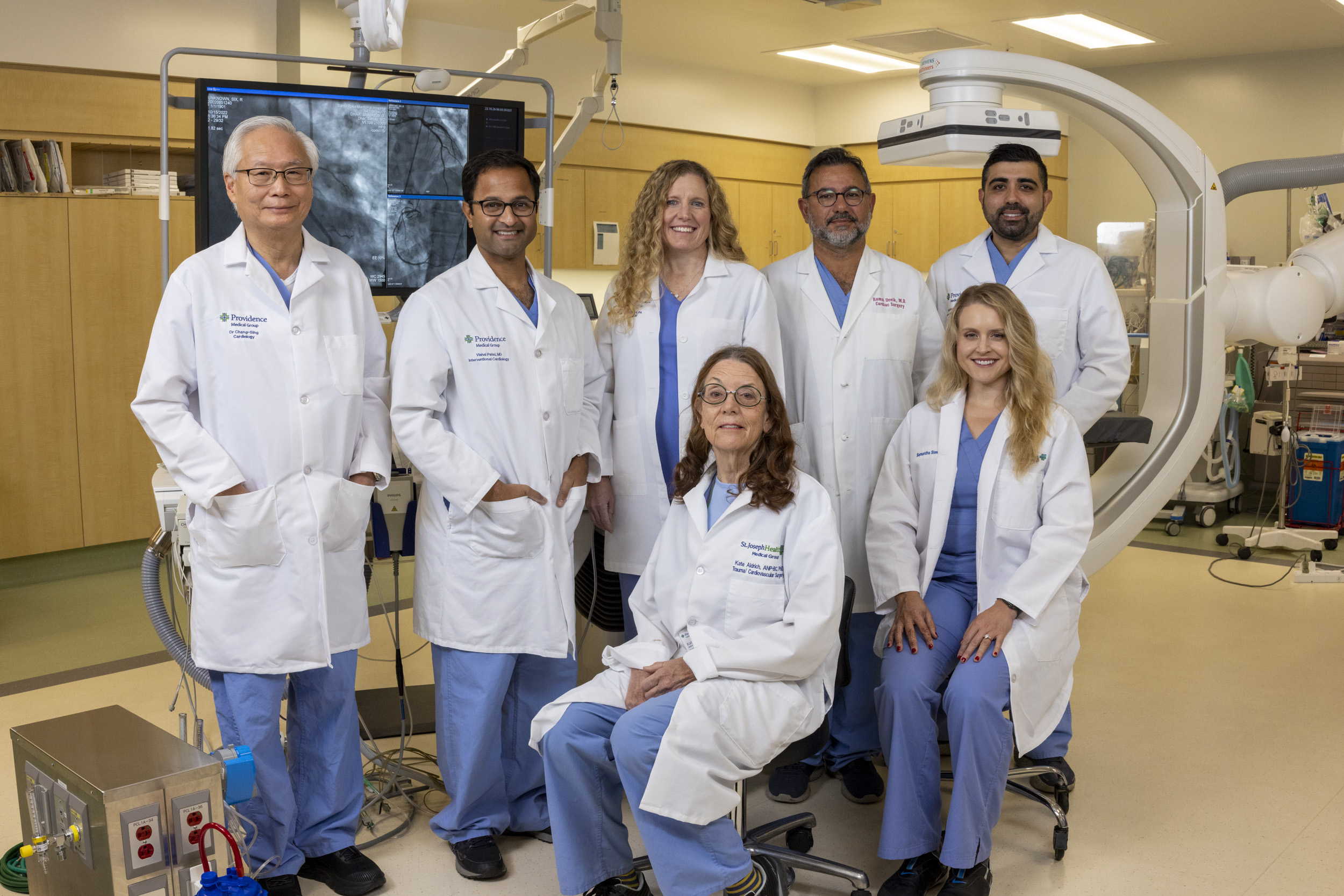 Lesley M Field, PA-C, MPH, MSPAS (top row, center) stands with the Structural Heart team at Providence Santa Rosa Memorial Hospital