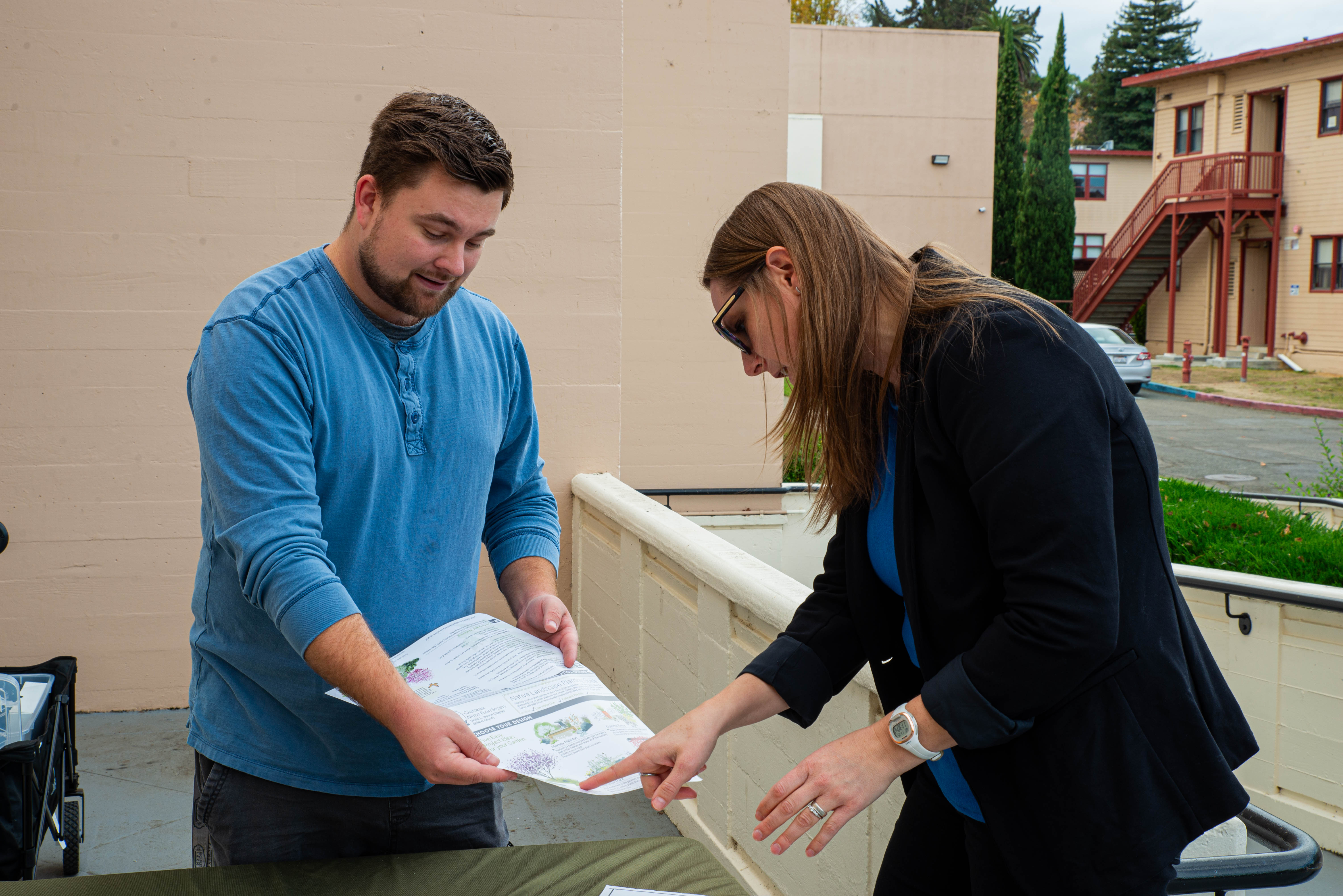 Sustainable Solano\'s Program Manager, Patrick Murphy (left) discusses plant options with Sarah Passage (right), Chief of Staff for the Dean’s Office.