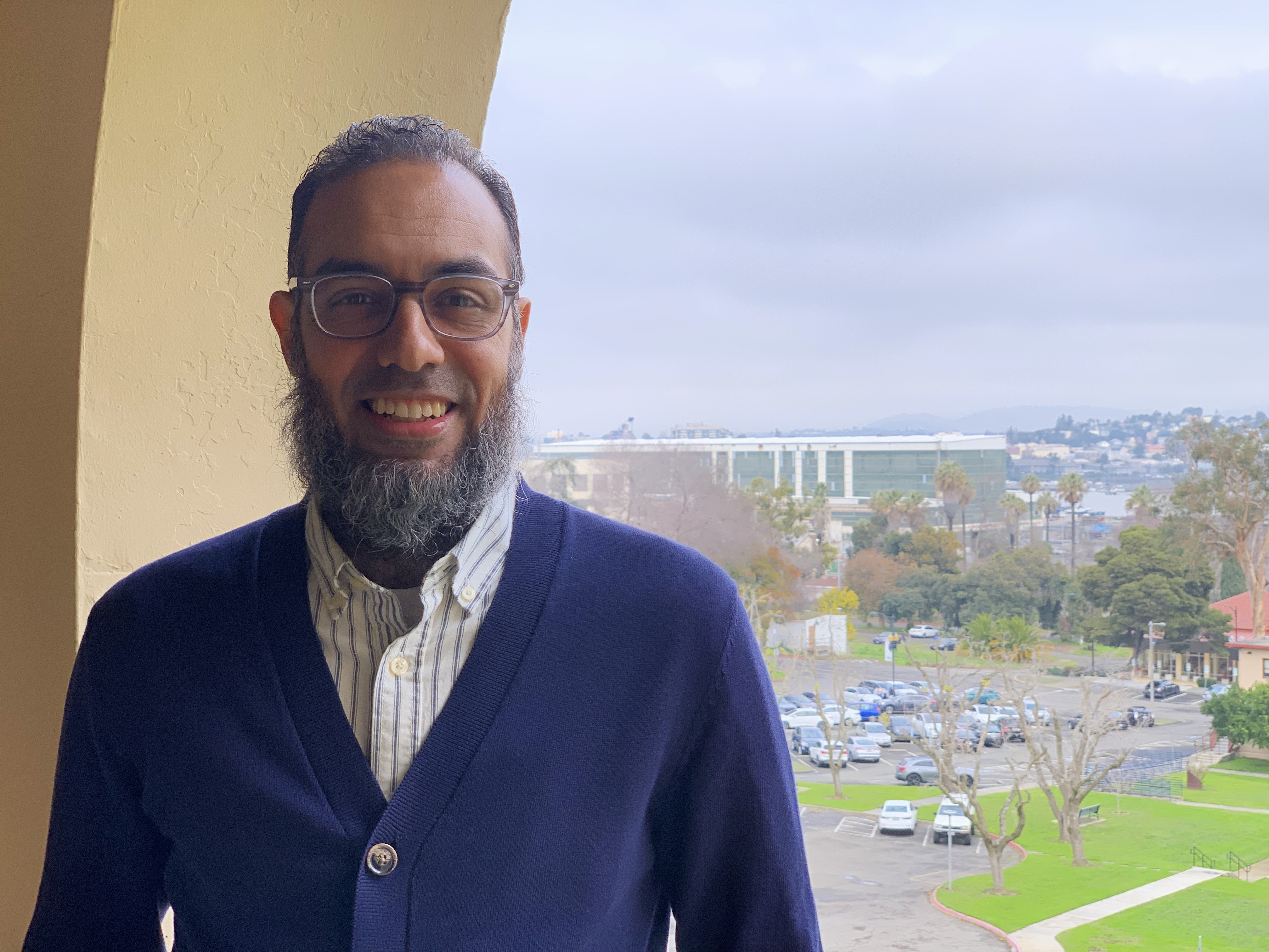  Associate Dean of the College of Education and Health Sciences Dr. Farid Khalafalla stands in front of a view of the lower Touro campus behind him