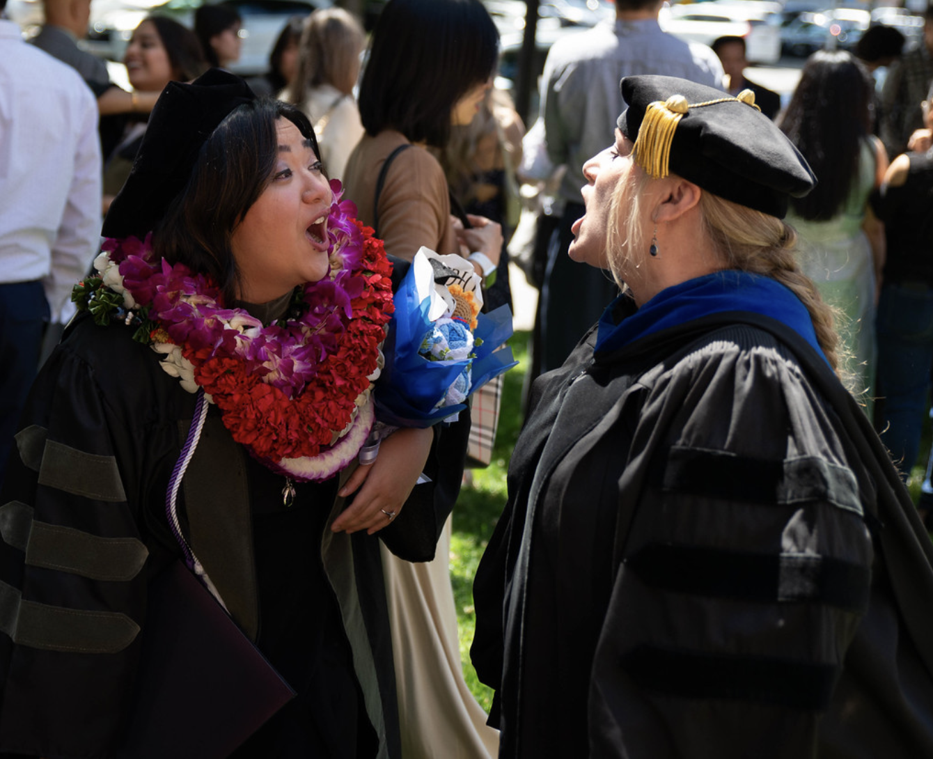 A photo shows students and faculty celebrating after a Commencement ceremony for the College of Pharmacy on May 20 at the Sacramento Memorial Auditorium.