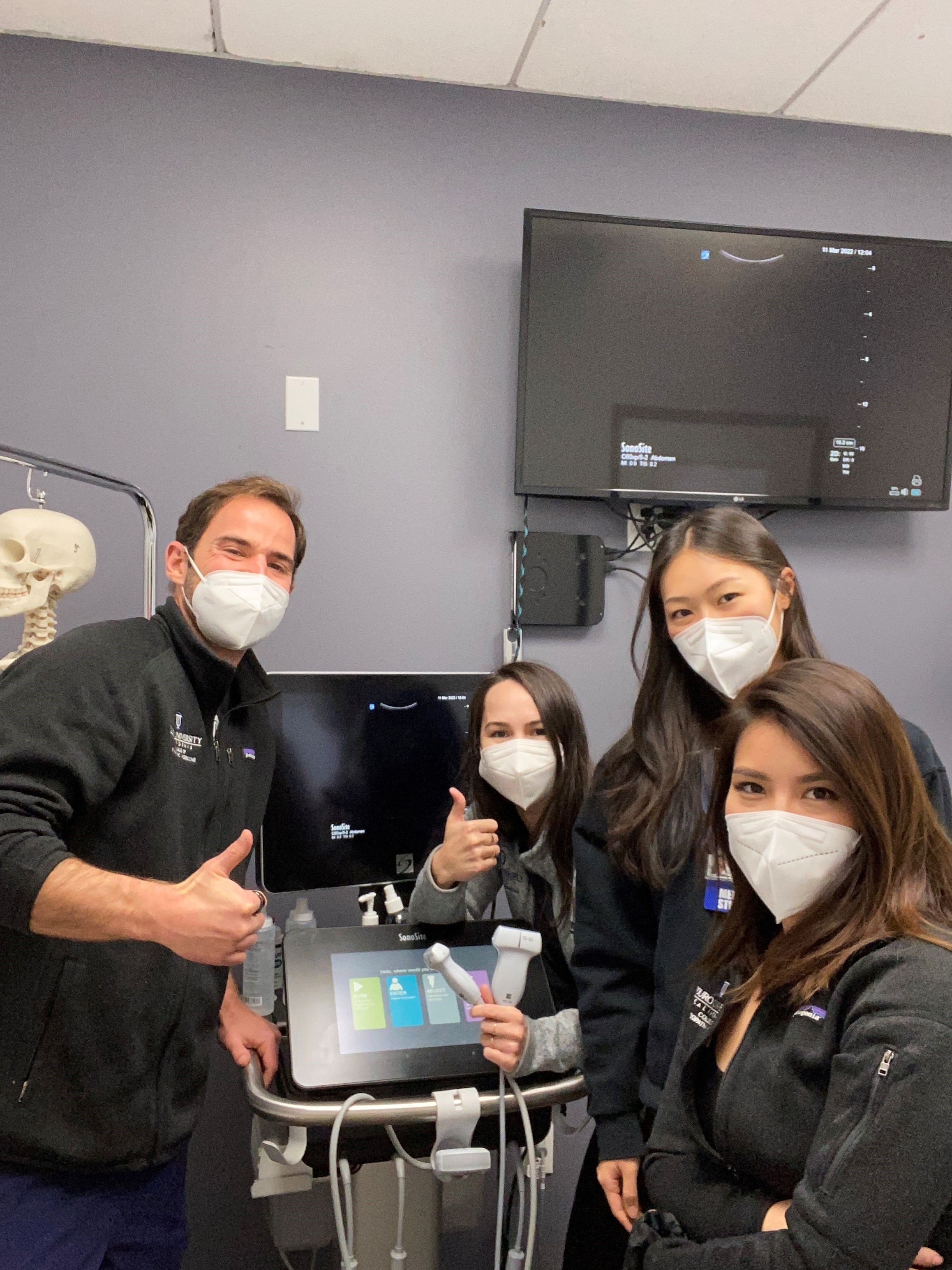 A group of Touro students inside an ultrasound lab.